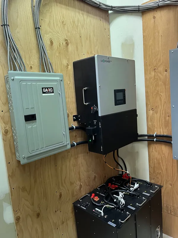 Inverter and batteries on wall