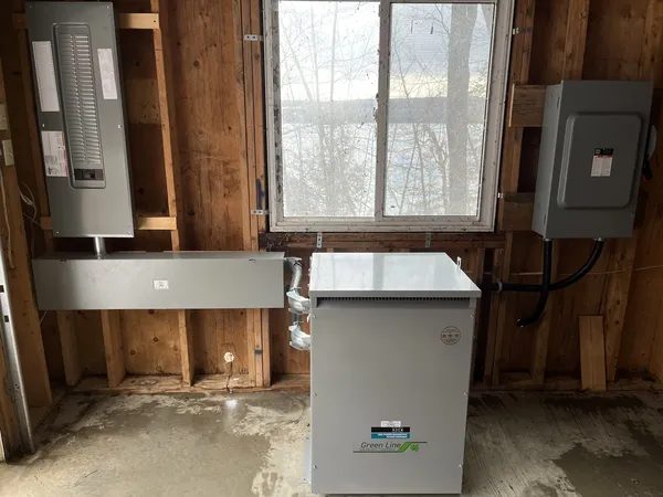 Electrical meter near basement window