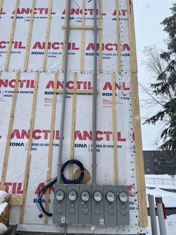 Meters on exterior wall at worksite